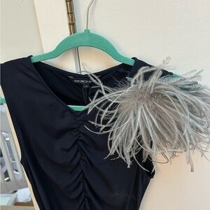 Elegant Feather Brooch with Leather Details